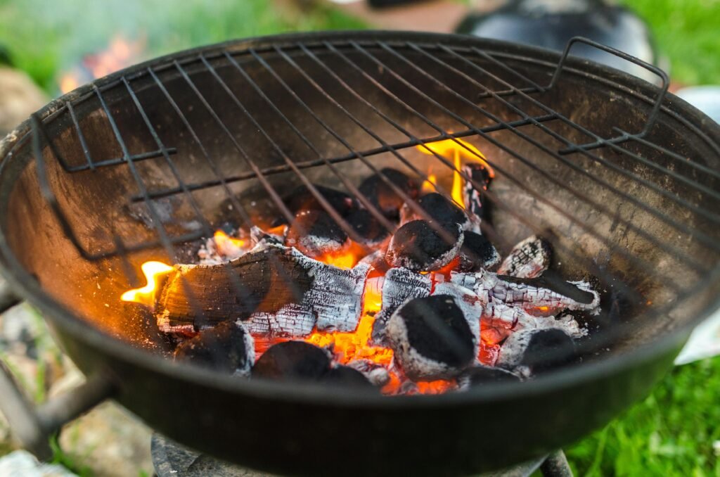 pexels photo 1309067 1309067 A detailed view of burning charcoal in a BBQ grill, perfect for outdoor cooking.